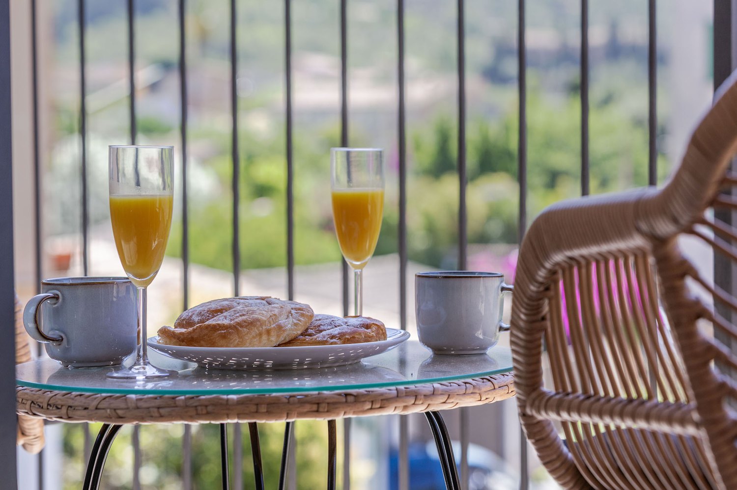 Breakfast on the balcony, the gardens of the valley behind